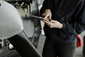Aircraft maintenance mechanic inspecting